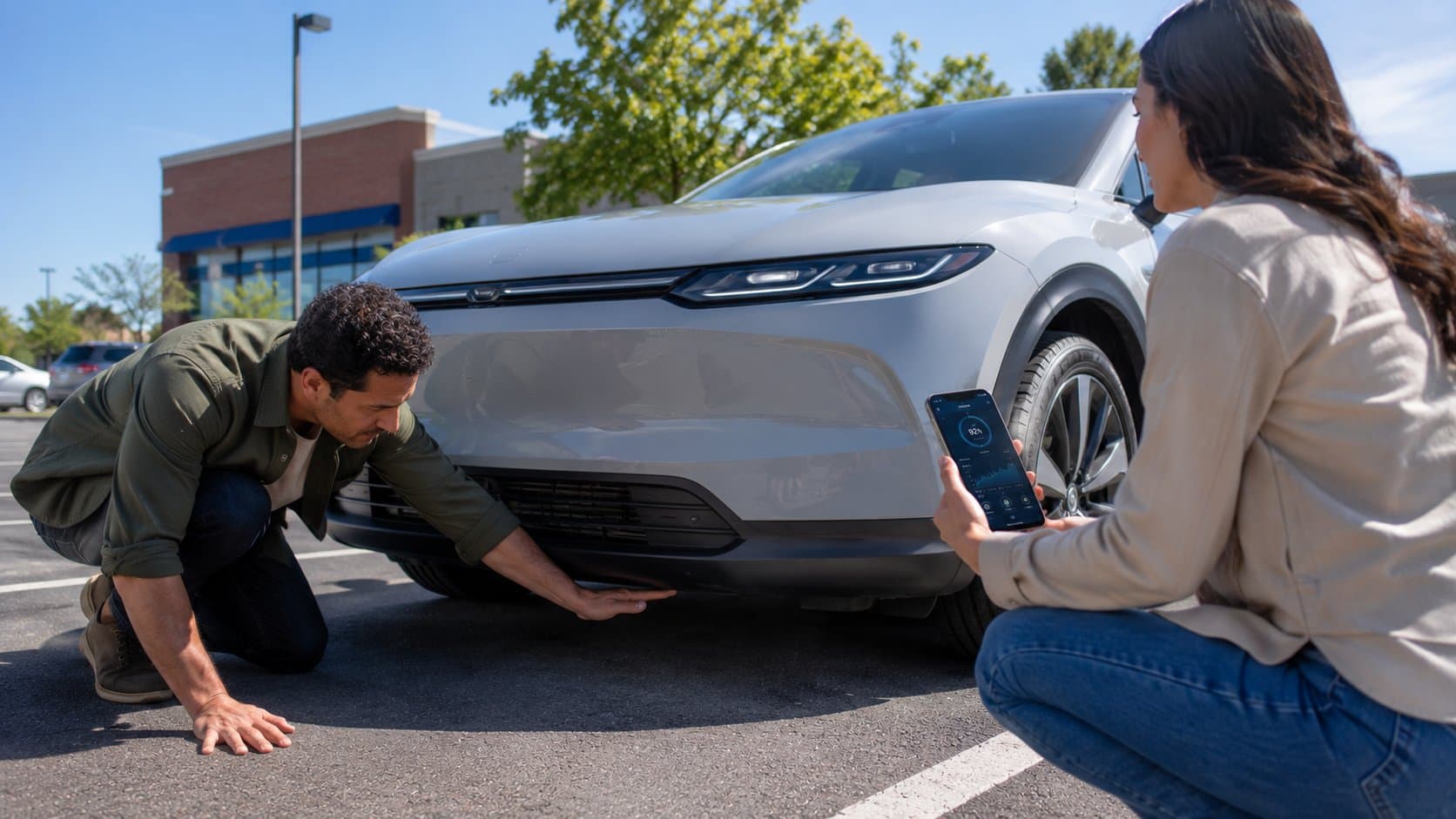 Buyer inspecting a used EV from a private seller
