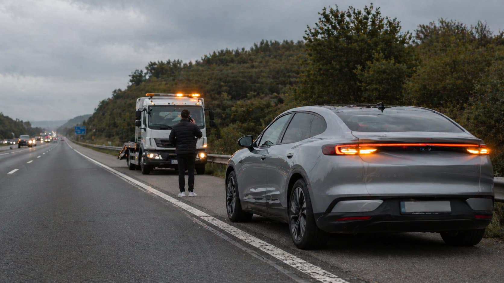 EV being assisted on the side of a road